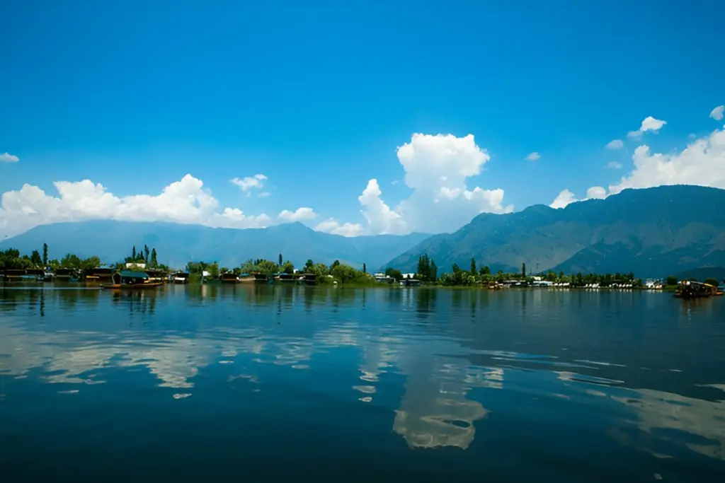 Lake framed by mountains under a blue sky