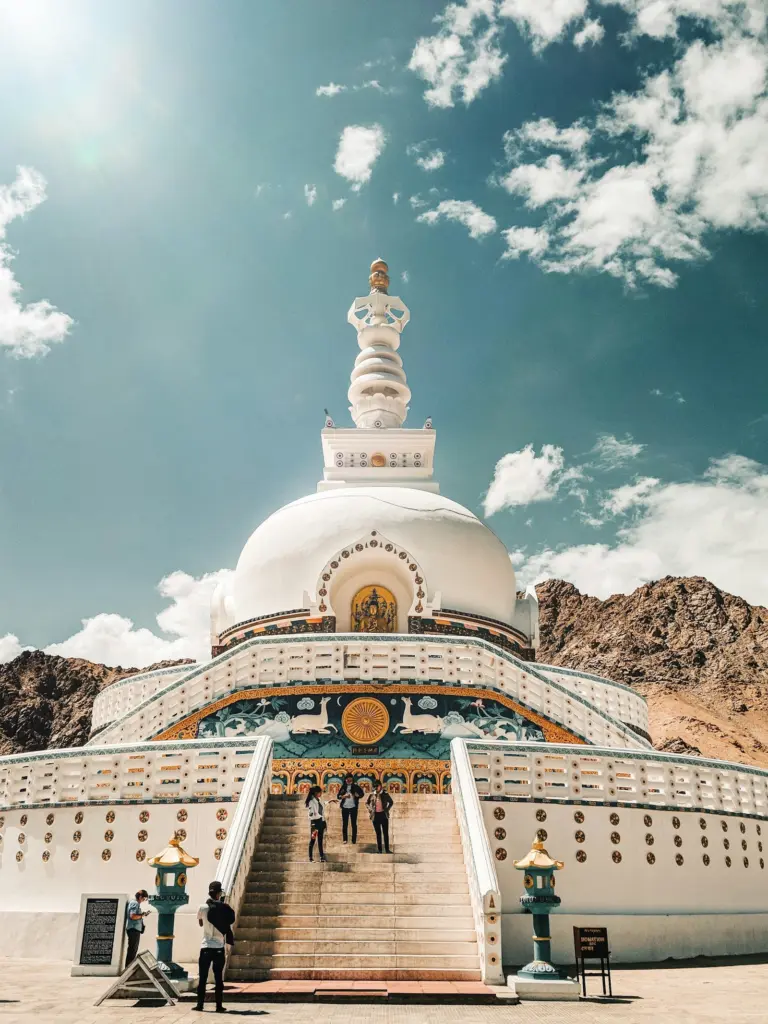 White and gold Shanti Stupa under a blue sky in Leh
