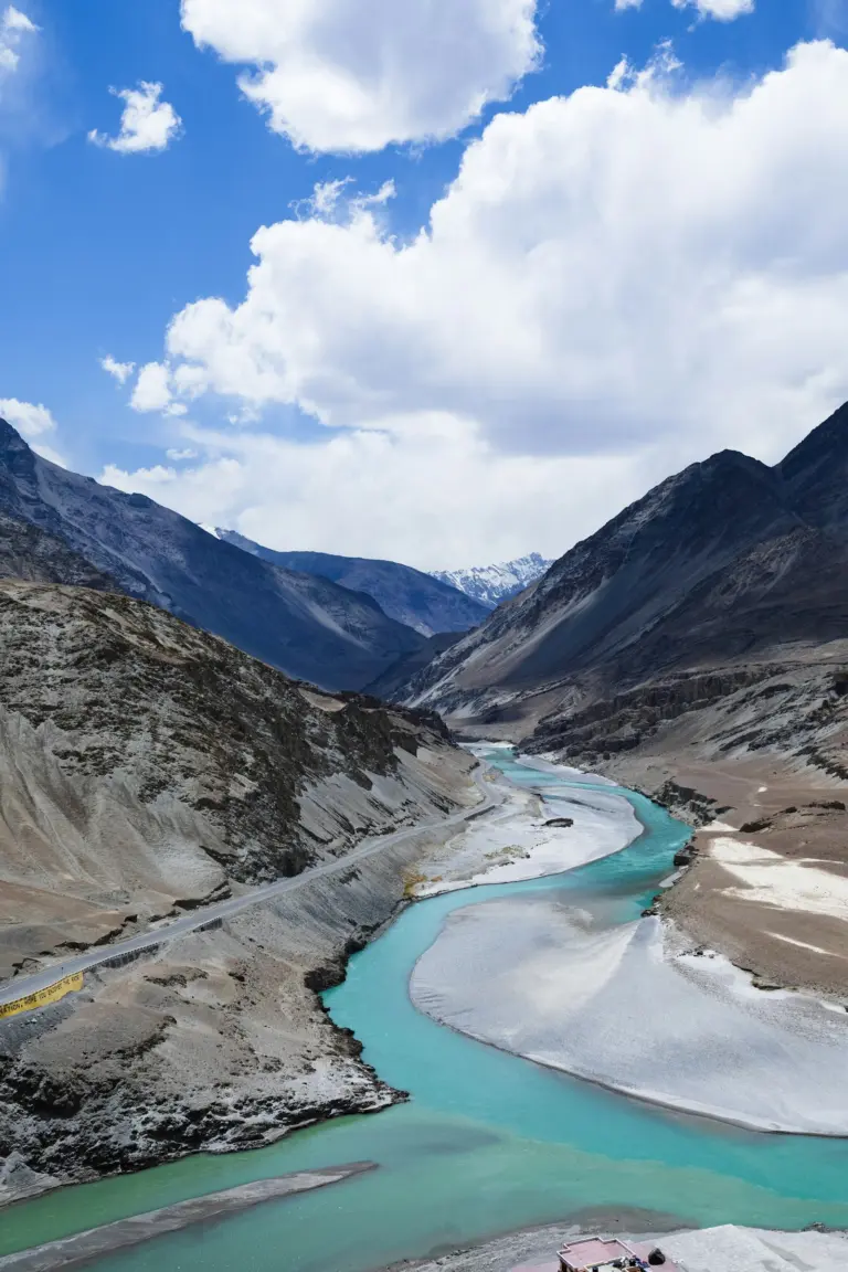 Turquoise Indus and Zanskar rivers meeting at the confluence near Leh